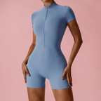 Blue bodysuit worn by a person on a pink background