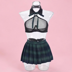 A two-piece schoolgirl-inspired outfit displayed on a clear mannequin torso against a solid pink background. The set includes a dark green and black sheer mesh halter-style bra top with a matching necktie and a dark green plaid pleated mini skirt.