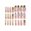 pink and yellow nails with a butterfly pattern