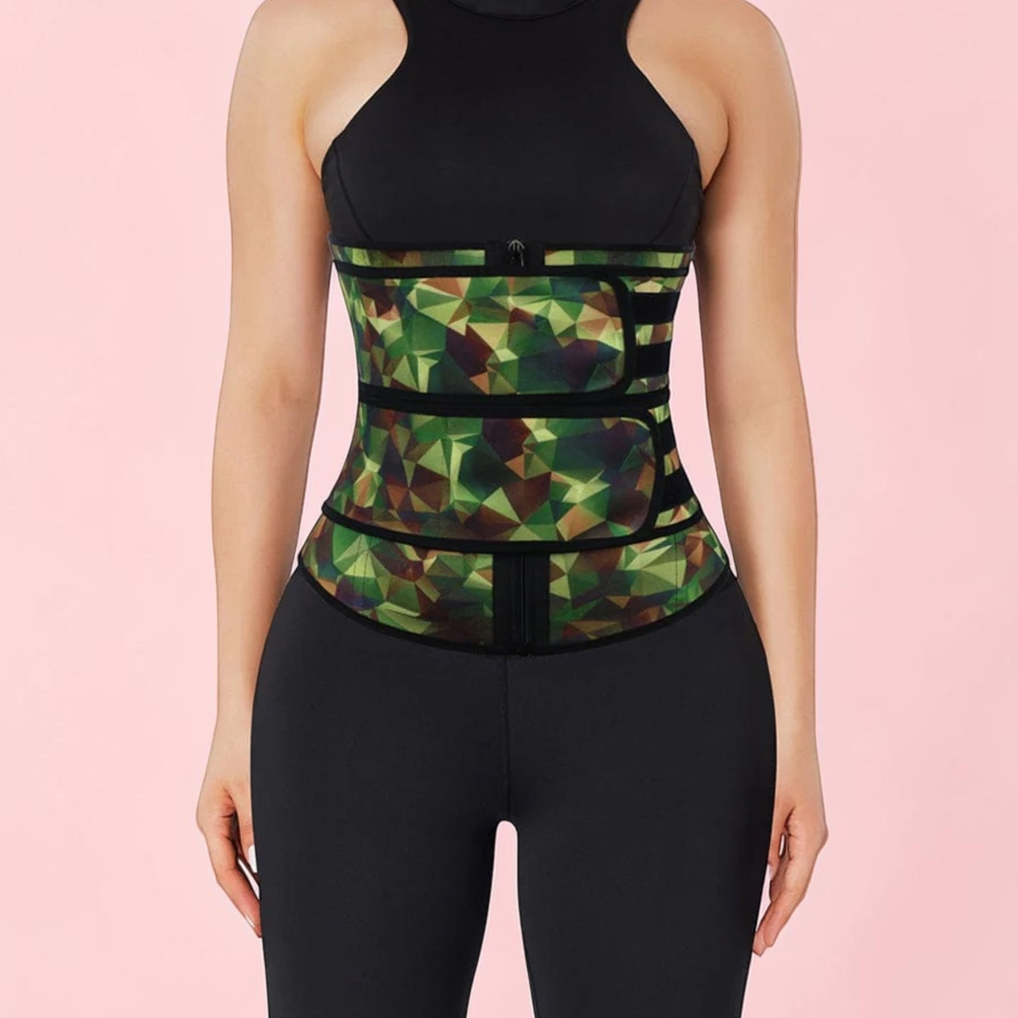 Green geometric patterned waist trainer worn by a person on a pink background