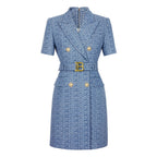 A blue notched retro geometric pattern blazer with a gold belt and buttons.