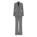 A two-piece blazer suit with a geometric pattern in gray and black, featuring a straight-cut design, gold-tone buttons, and pants to match.